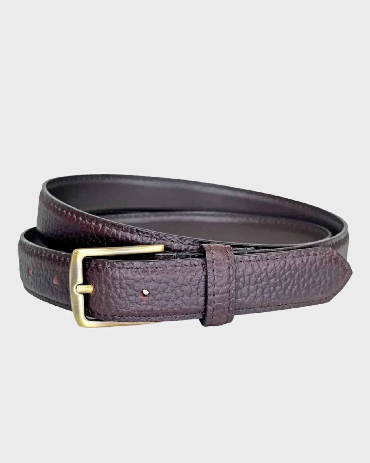 Brown leather belt on a light gray background